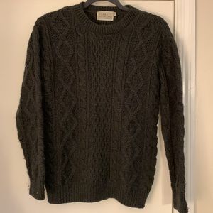 Authentic 100% Irish wool sweater in classic cable knit pattern in Hunter green.